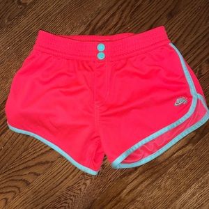 pink and teal kids Nike shorts